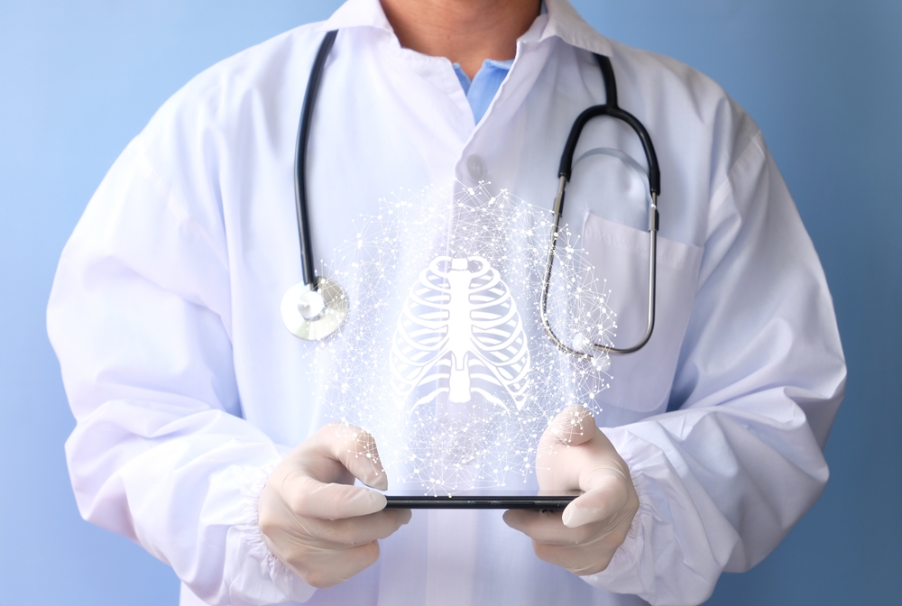 Doctor examines the bone hologram. Trauma, rheumatologist consultation, skeletal image